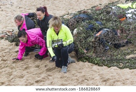 WHITLEY BAY, NORTH TYNESIDE- APRIL 5, 2014. Warriors Beach Assault, Charity Fun Run. Whitley Bay Beach front on Saturday 5, 2014 Whitley Bay, North Tyneside, England, UK