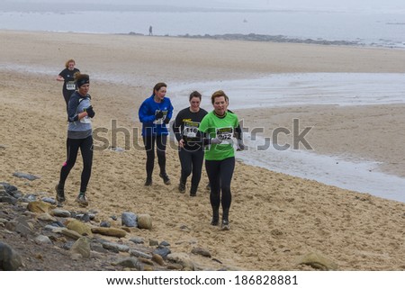 WHITLEY BAY, NORTH TYNESIDE- APRIL 5, 2014. Warriors Beach Assault, Charity Fun Run. Whitley Bay Beach front on April 5, 2014 Whitley Bay, North Tyneside, England, UK