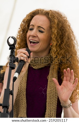 NORTHUMBERLAND, ENGLAND, AUGUST 30, 2014. Female singer, Rudi, performs at fund raising event in aid of Great North Air Ambulance. August 30, 2014, Northumberland, England, UK.