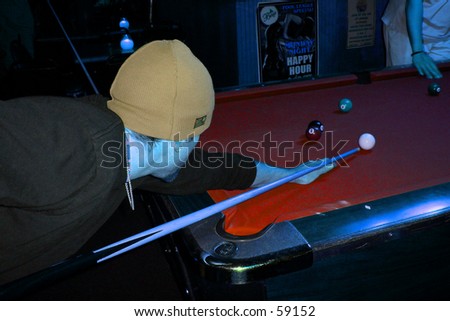 young man playing pool, cool color effect. Stay cool under pressure! A heated competition.