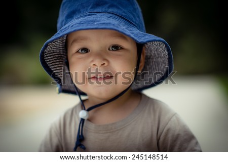 Similar – Image, Stock Photo child wearing a hat and glasses smiling at the camera