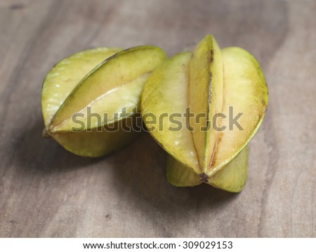 star apple or star fruit on wood background