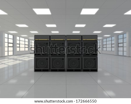 A large empty room in which there are guitar amps