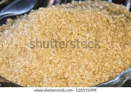 Brown Sugar/ a macro shot of brown sugar crystals in a glass bowl