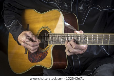 Guitar playing/close up of a country western guitarist