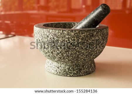 mortar and pestle/ a stone set in a modern kitchen