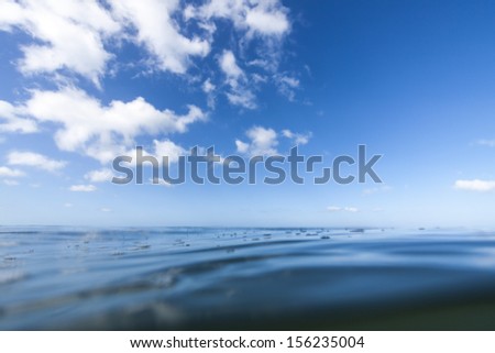 blue sea and sky/ shot using a water housing at sea level, a perfect still day in the ocean