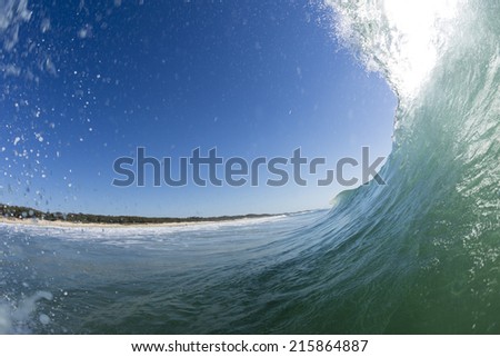 Wave Tubes/ a perfect wave pitches over creating a tube. On the Sunshine Coast of Queensland, Australia.