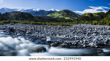 South Island River/ a classic view of one of New Zealand\'s South Island riverbeds with the Alps in the background