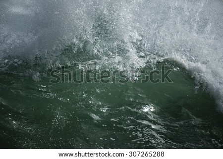 Shore Break Surf/ a full frame image of a shore break or shore dump breaking