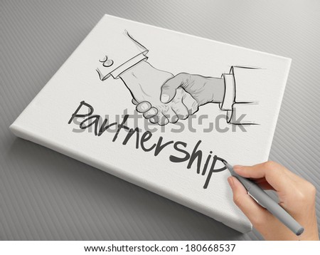 hand drawn handshake sign on canvas board as partnership business concept