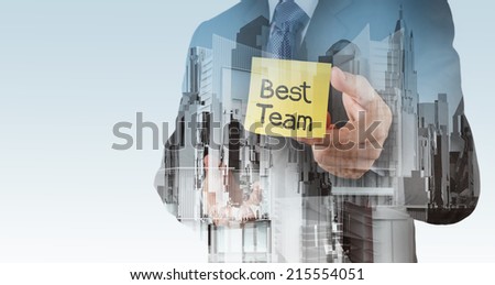 businessman hand show best team words on sticky note with abstract city as concept