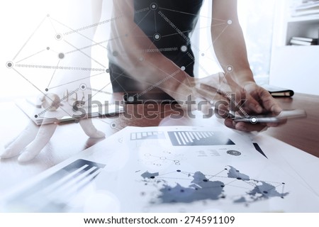 Moving Abstract Image of Business creative designer working with smart phone and tablet computer at office as concept