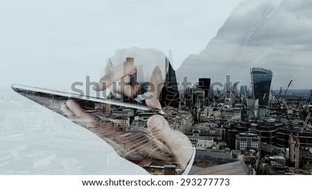 Double exposure of businessman working with new modern computer and london city background as concept