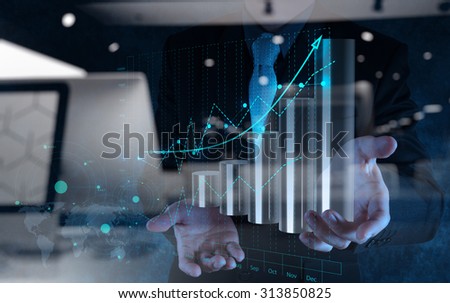 double exposure of businessman hand working with virtual chart business on touch screen computer as concept