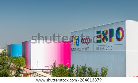 MILAN, ITALY - JUNE 3, 2015 - Expo Milano 2015, Magenta, cyan gradient building and future food district building with ffd, coop and expo milano 2015 logo in exhibition site