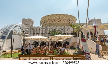 MILAN - JUNE 3, 2015 - Expo Milano 2015, Visitors line up long queue to visit Qatar Pavilion showcases a holistic, interactive and informative experience. The design inspired by Al Jefeer, food basket