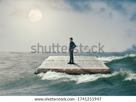 man sailing on the Holy Bible, in rough seas, seeking salvation by faith in Jesus Christ, Son of God. Biblical concept of Christianity