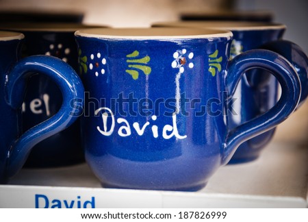 LES BAUX-DE-PROVENCE, FRANCE - MAY 16, 2013: Blue mug with name DAVID is sold in souvenir shop. Les Baux-de-Provence, one of \