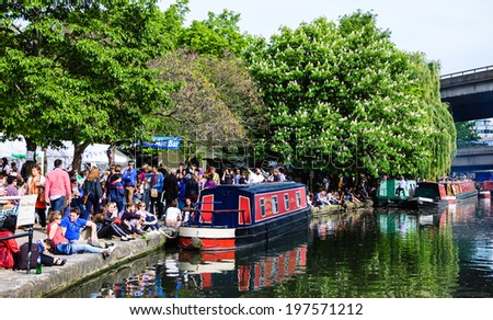 LONDON, ENGLAND, UK - MAY 5, 2014: Unidentified people participate in annual Canalway Cavalcade, a unique waterways festival of traditional boats, taking place in Little Venice (Paddington, London).