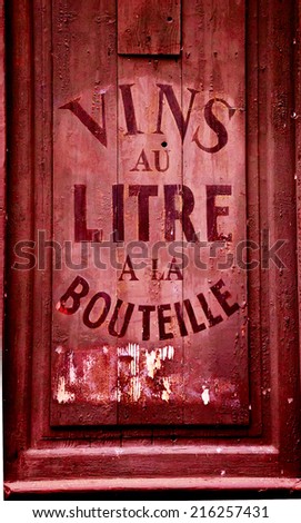 Old wine and spirit cellar sign. Text in French 