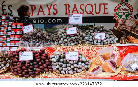 PARIS, FRANCE - OCTOBER 5, 2014: A stall of  Basque sausages and other traditional products at food market.  French Basque Country is a part of Pyrenees-Atlantiques department of France.