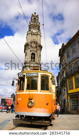 PORTO, PORTUGAL - APRIL 26, 2015: Unidentified senior man getting on the old tram near the Clerigos Tower, one of the famous landmarks and symbols of the city.