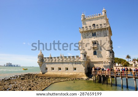 Belem tower and tourists waiting in line. Lisbon, Portugal.