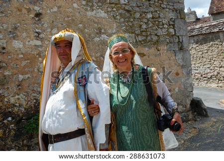 PROVINS, FRANCE - JUNE 23, 2012: Mid-aged couple in medieval costume during the traditional Medieval festival. Medieval town of Provins is UNESCO World Heritage Site.