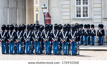 COPENHAGEN - MAY 9, 2013: Soldiers of the Danish Royal Life Guards line up for the changing of the guards on the central plaza of Amalienborg palace in Copenhagen, circa May 2013.