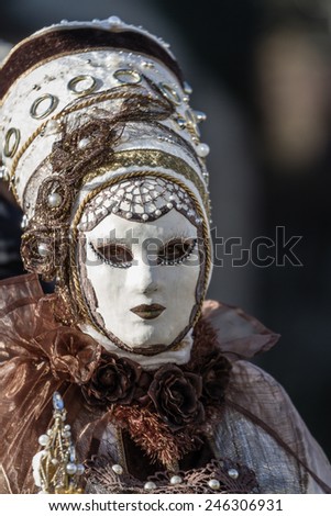 SCHWAEBISCH-HALL, GERMANY - February 23, 2014 - Person, dressed up in a Venetian style costume with plaster mask attends the Hallia Venetia Carnival festival on February 23, 2014 in Schwabisch-Hall.