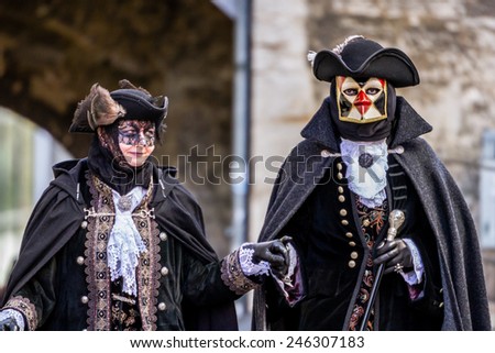 SCHWAEBISCH-HALL, GERMANY - February 23, 2014 - Man and a woman, dressed up in Venetian style costumes attend the Hallia Venetia Carnival festival on February 23, 2014 in Schwabisch-Hall.