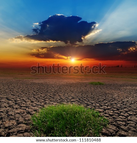dramatic sunset over barren earth