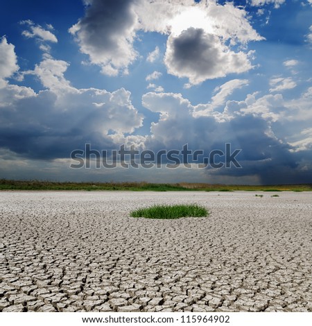 drought earth under rainy clouds