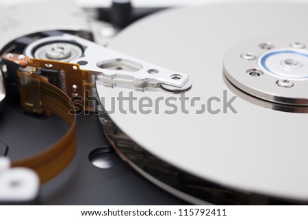 Close up of opened hard disk drive, data saving.