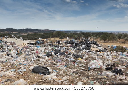 ALEXANDROUPOLIS, GREECE - SEPTEMBER 11: A section of a landfill located on September 11, 2012 in Alexandroupolis, Greece. Though forbidden this way for the municipality garbage, still exists.
