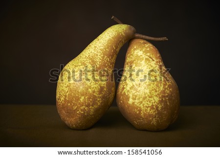 Yellow pears on a wooden table