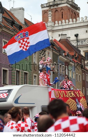 POZNAN, POLAND - JUNE 10: Croatia football team supporters cheering and waving flag before the match on June 10, 2012 in Poznan, Poland.