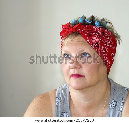 Female with curls in hair and messy red lipstick in the morning