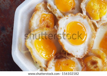 Fried quail egg on foam