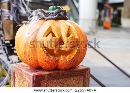 halloween scary pumpkin on wooden box