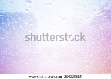 blurred raindrops on glass with fog on abstract pastel  gradient background with grunge paper texture