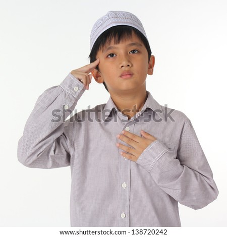 Islamic pray explanation. Asian child showing complete Muslim movements while praying