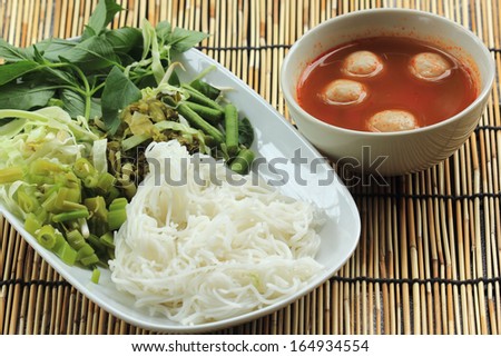 Thai Fish ball curry coconut soup with rice noodles and vegetable