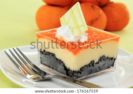 Orange Biscuit cake Layer with cheese cake and orange background