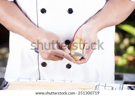 Chef peeling Potato with knife/ Cooking Japanese curry concept