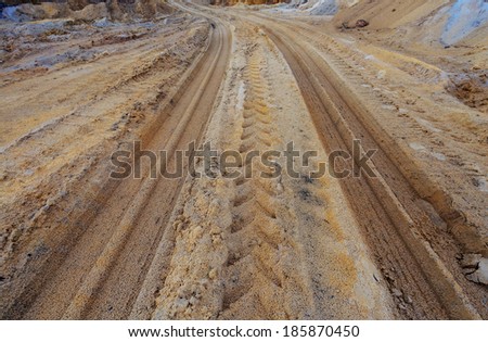 Tractor tire tracks on ground, in construction site