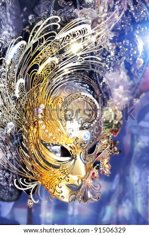 golden venetian mask on a blue background
