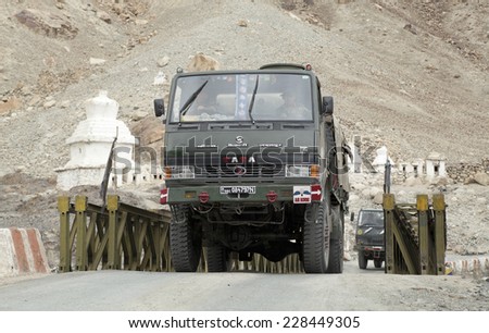 HUNDER, LADAKH, INDIA - CIRCA JULY 2014: Indian airborne forces army convoy crosses bridge at Hunder on the Kargil - Leh highway near the \'Line of Control\' on the Pakistan, India border