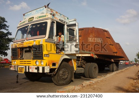 GUJARAT, INDIA - CIRCA MAY 2012: Indian truck carrying heavy load on busy highway